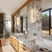 Baño de Casa Ficus con tocador de mármol de vetas oscuras y madera